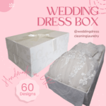A beautifully designed white wedding dress storage box with elegant silver detailing and a sturdy lid, perfect for preserving a wedding gown.